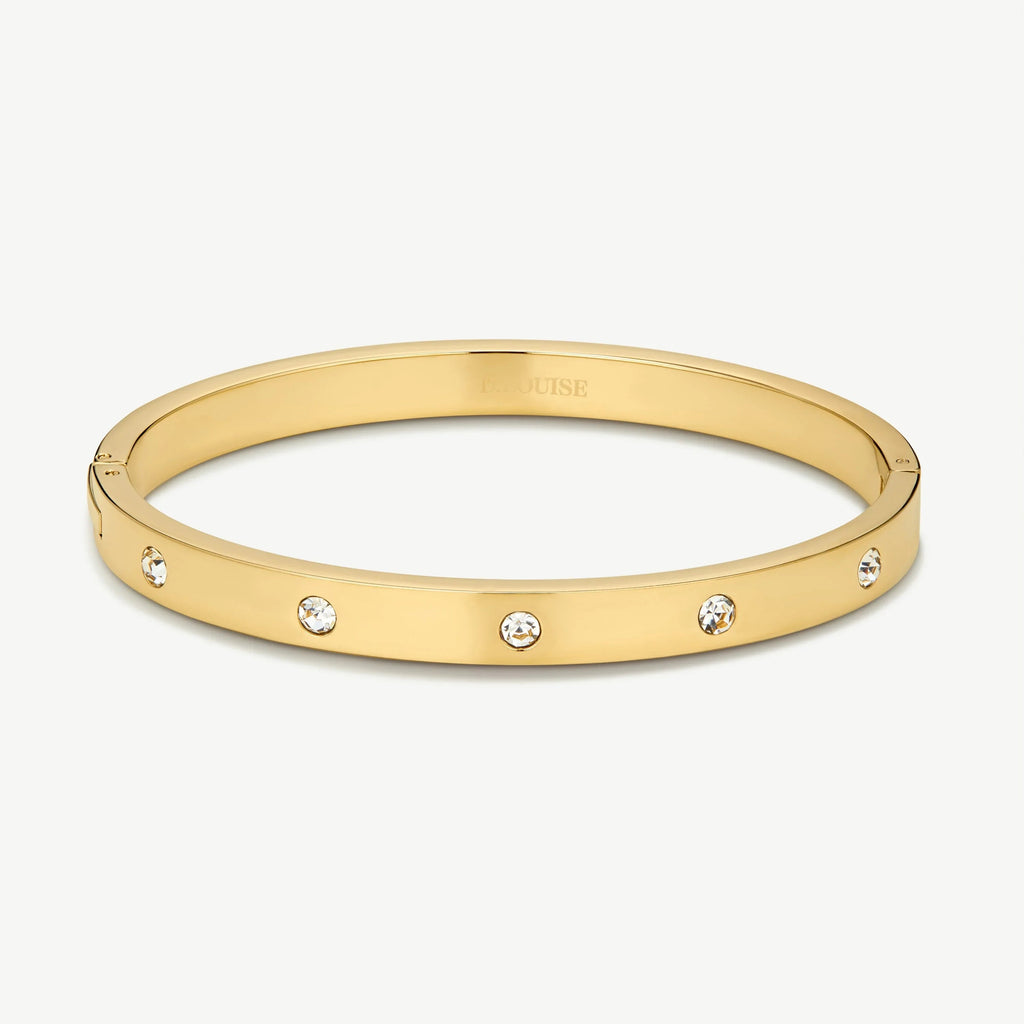 Elegant gold bangle bracelet with evenly spaced clear crystals on a white background