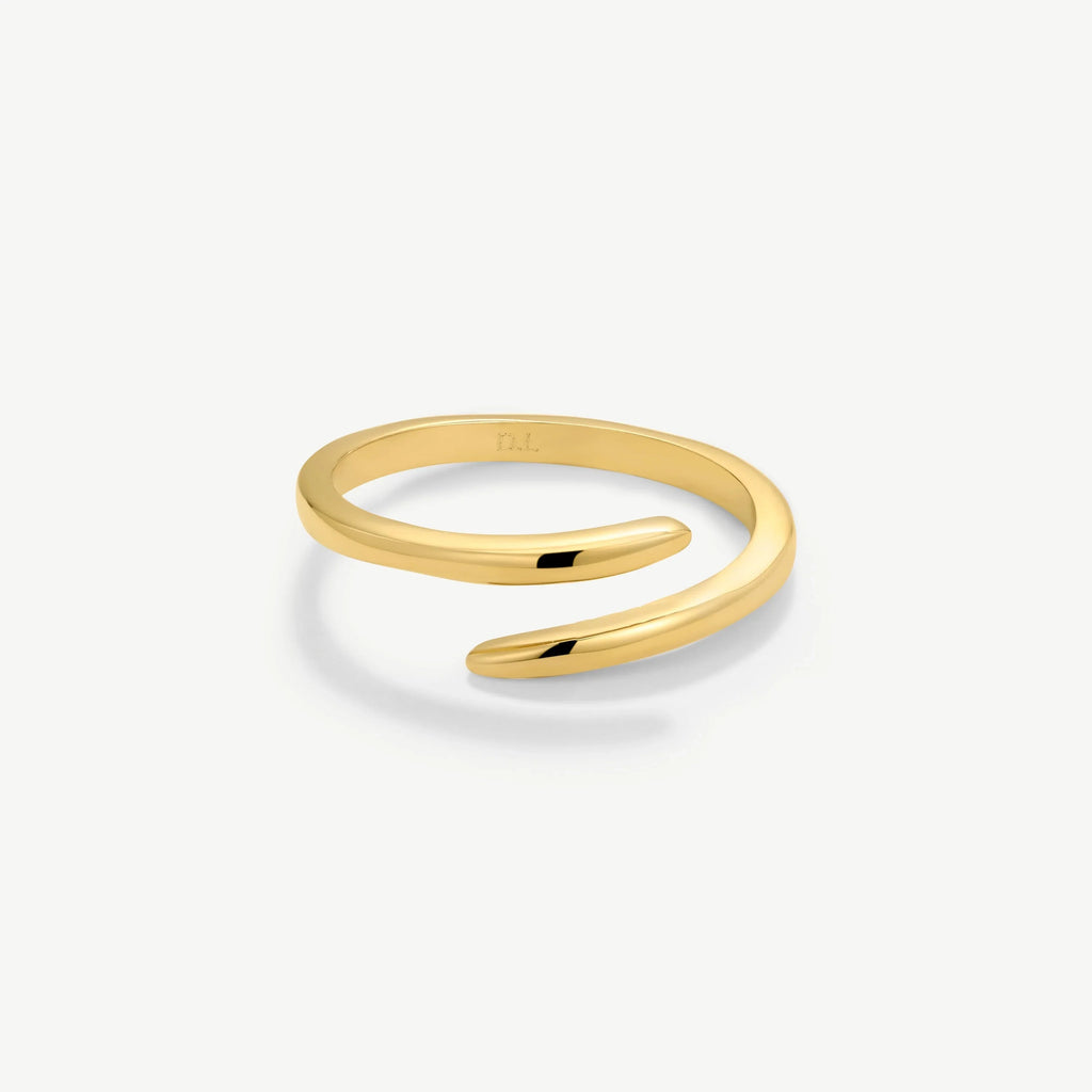 Minimalist open-ended gold ring with smooth, polished finish on white background
