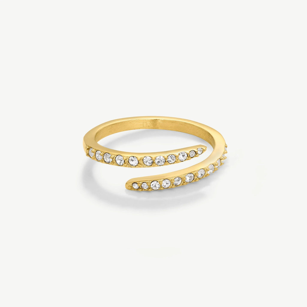 Elegant gold wrap ring adorned with clear round crystals on a white background