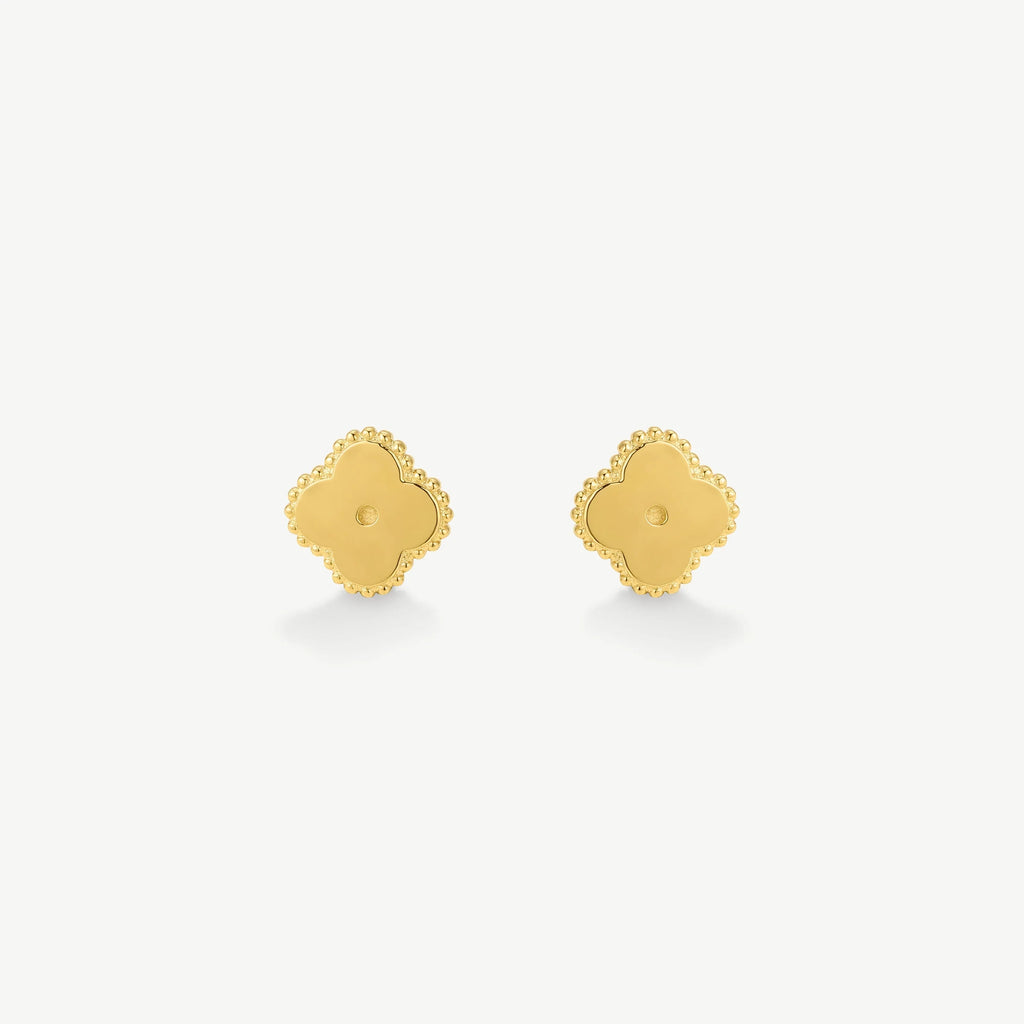 Pair of gold clover-shaped stud earrings with beaded edges on white background