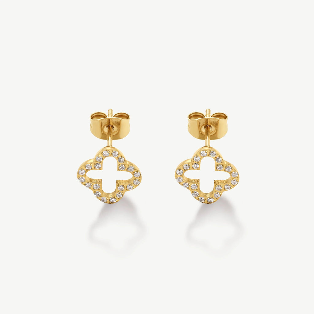 Gold stud earrings in open clover shape with embedded small diamonds on white background