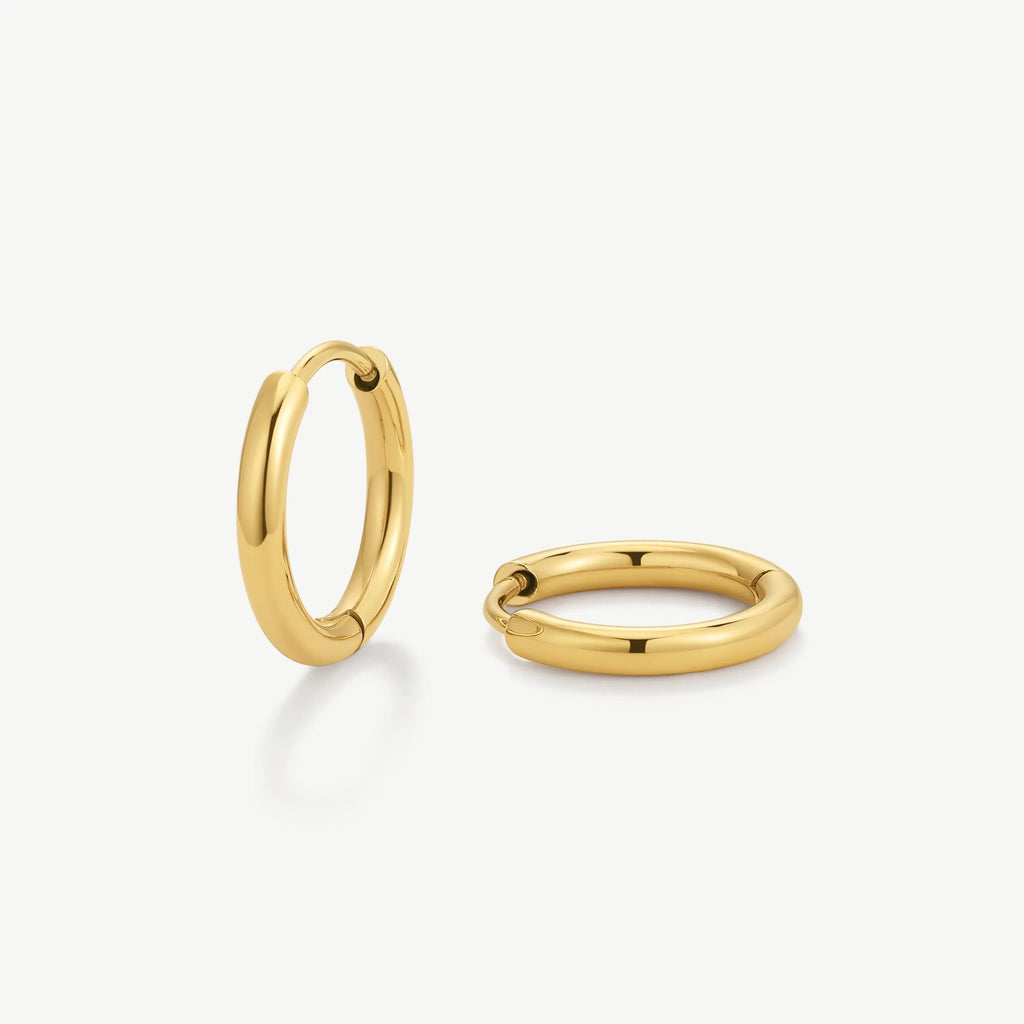 Pair of polished gold hoop earrings with smooth, rounded design on white background