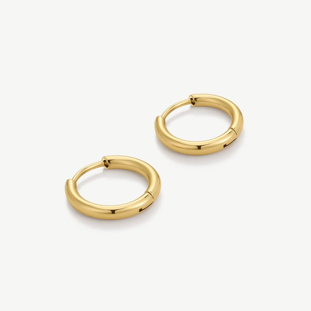 Pair of polished gold hoop earrings on a white background