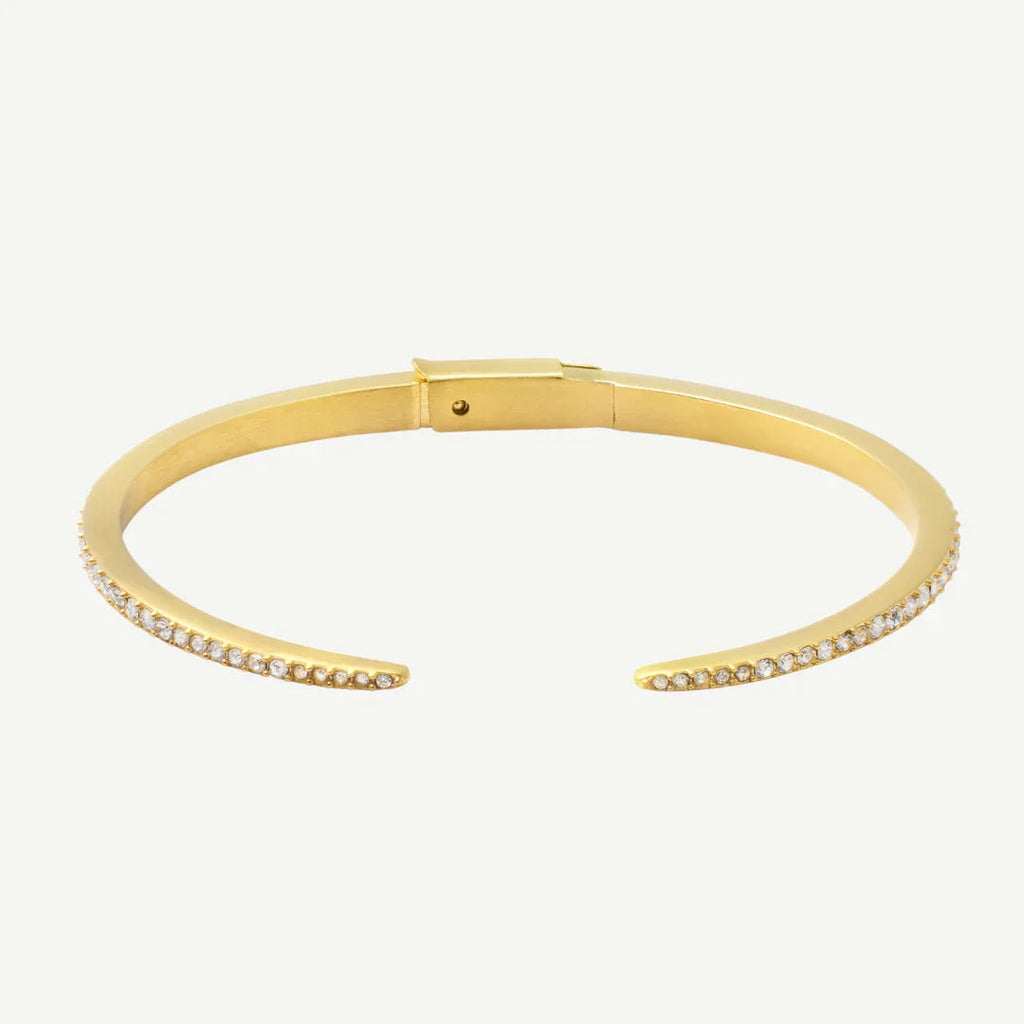 Elegant gold cuff bracelet with a row of small sparkling stones on each open end