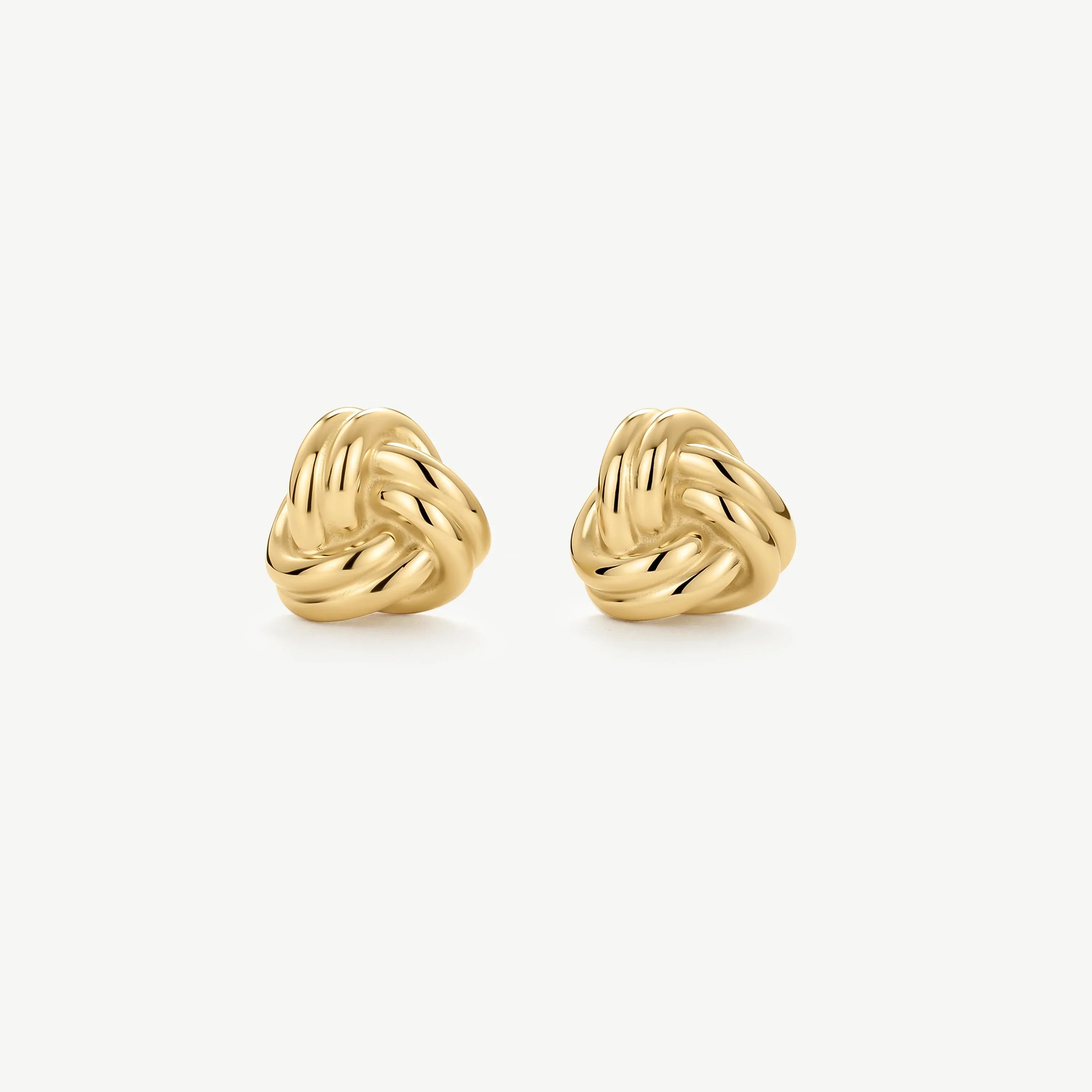 Pair of shiny gold knot stud earrings on white background, elegant jewelry accessory