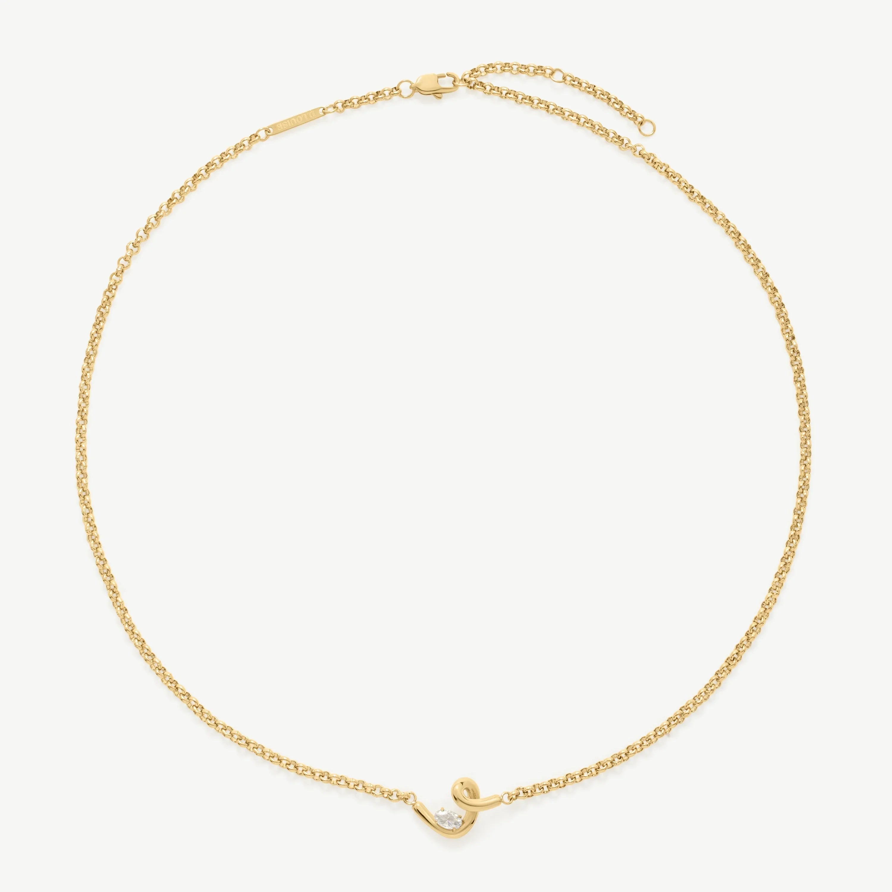 Elegant yellow gold chain bracelet with a small curved pendant and a clear round gemstone
